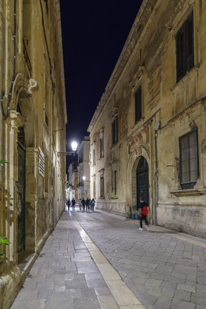 Lecce, Italy - October 30, 2023: Night view the street in the city center of Lecce, Apulia, Italyのeditorial素材