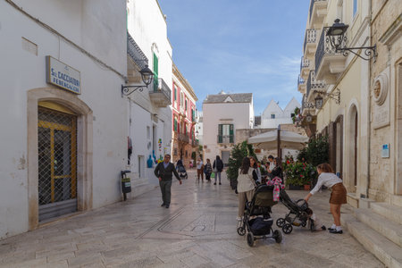 Locorotondo, Italy - November 1, 2023: View of whitewashed street in the old town of Locorotondo, Itria Valley, Apuglia regionのeditorial素材