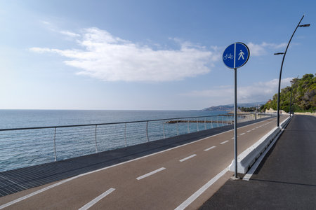 The cycling path into the Riviera dei Fiori coastal park (also called Coastal Park of Western Liguria) is one of the longest in Europe, with a path accessible by pedestrians and cyclists in both directionsの写真素材