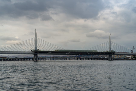 View of the Metro Bridge, railway and pedestrian bridge spanning the Golden Horn in Azapkapi, Istanbulの写真素材