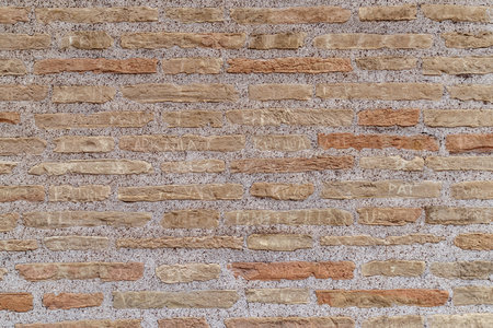 Colosseum wall, showing details of the bricks with names carved oninside the ancient Amphitheater in downtown Rome. Tourists who carve their initials on the ancient wall of the amphitheater damage buildings of historical and artistic interestの写真素材