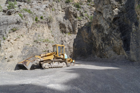 Mining machinery working over rocksの写真素材