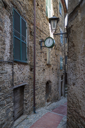 View along narrow street in the medieval village of Ceriana in Province of Imperia, Liguria region, Italyの写真素材