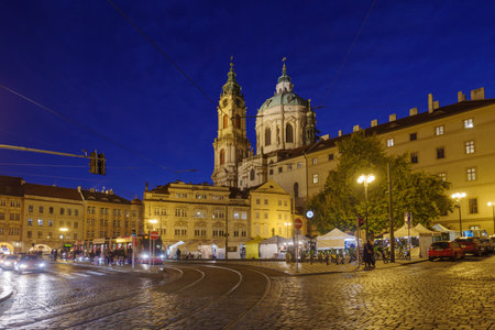 Prague, Czech Republic - 4 November 2025: St Nicholas's Church against famous old street in Mala Strana (Lesser Town) in Prague, Czech Republicのeditorial素材