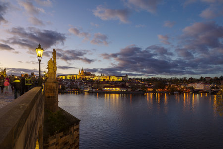 Prague, Czech Republic - 3 November 2025: A view of Castle of Prague and Charles bridge on an autumn day, close before the sunsetのeditorial素材