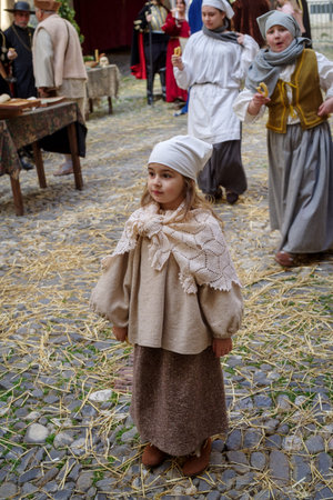 Taggia, Italy - March 8, 2026: Participants of historical reenactment in the old town of Taggia, in Liguria region of Italy. The actors acting out episodes of daily life in settings that evoke moments of life lived fully the seventeenth century. The episoのeditorial素材
