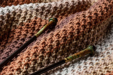 Fragment of a knitted product close-up. Waves on a knitted plaid. Background. Abstraction.の写真素材