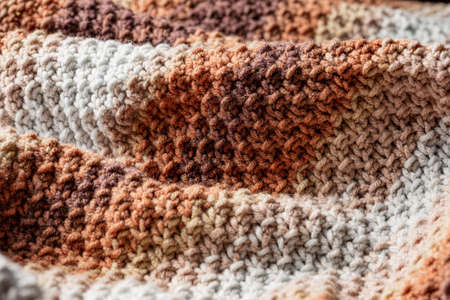Fragment of a knitted product close-up. Waves on a knitted plaid. Background. Abstraction.の写真素材