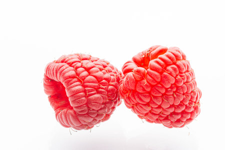 Ripe raspberries on a white background. Berries. Garden raspberries. White background. Red berries. Isolated.の写真素材