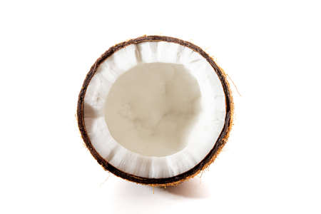 Coconut on a black background. Chopped coconut. Several parts. Stone surface. Fresh coconut. White pulp.の写真素材