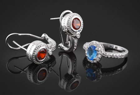 Jewelry set with diamonds on black background