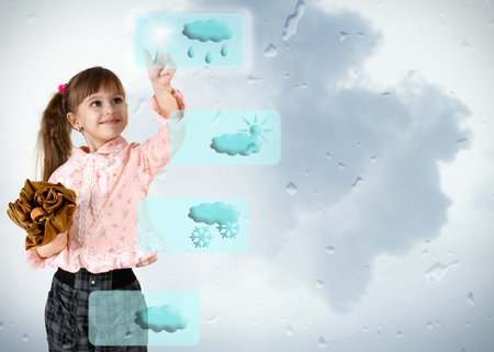 child girl pushing on weather button の写真素材