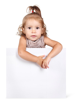 Funny child girl hold banner on white backgroundの写真素材