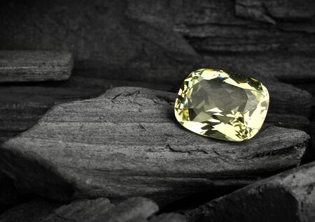 faceted gemstone on darck backgroundの写真素材