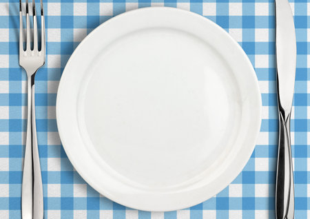 Table setting, empty plate and silverware, top view