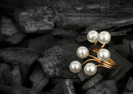 Jewellery ring with pearls on black backgroundの写真素材
