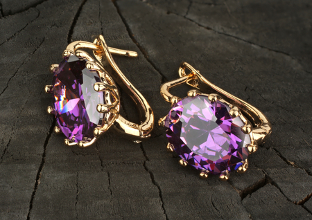 jewelry Earrings with gems on wooden backgroundの写真素材