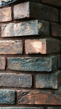 brickwork zigzag iridescent brick of different colors photographed vertically