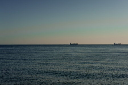A sunset over a body of water. High quality photoの写真素材