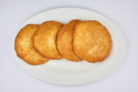 whites with meat on a white plate and white background