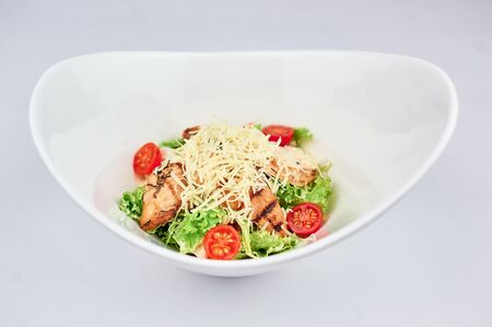 A bowl of food on a plateの写真素材