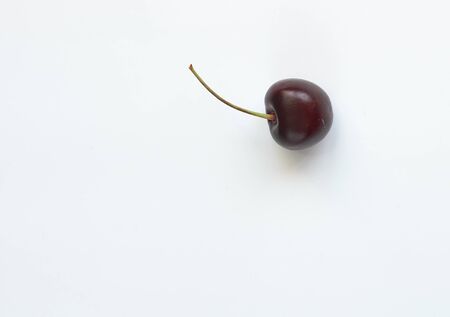 lonely bard cherry on a white background close-upの写真素材