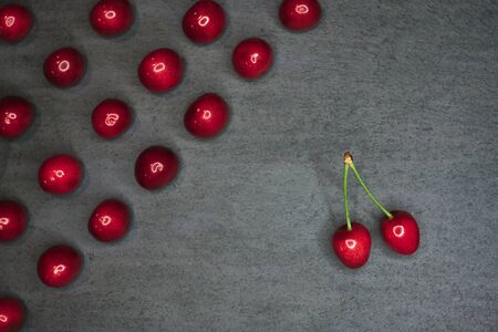 composition of cherries on a black stone backgroundの写真素材