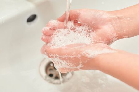 washing hands with soap under the tap. There is no pandemic.の写真素材