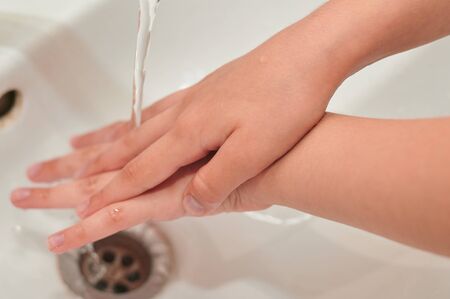 washing hands with soap under the tap. There is no pandemic.の写真素材