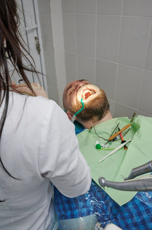 examination by a dentist, at a doctor's appointment, treatment and removal of caries, examination by...