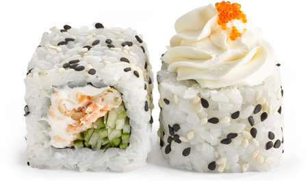 Sushi roll with crab, Philadelphia cheese and cucumber with sesame and masago caviar on a white backgroundの写真素材