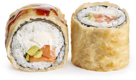 Tempura sushi roll with salmon, avocado, Philadelphia cheese and sesame on a white backgroundの写真素材