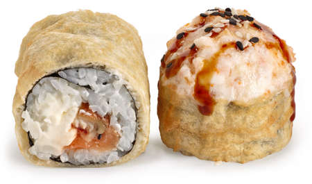 Tempura baked sushi roll with smoked eel, Philadelphia cheese, unagi sauce and sesame on a white backgroundの写真素材