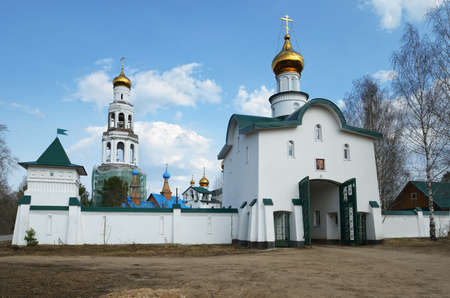 Beautiful views of the Orthodox monastery with Golden domes of the churches against the blue, cloudy sky.の写真素材