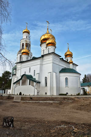 View of Orthodox monastery with Golden domes of the churches against the blue, cloudy sky.の写真素材
