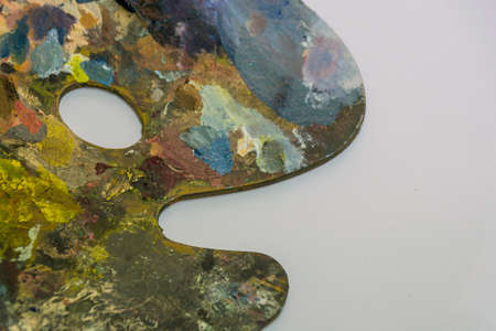 Palette with oil paint on white background. Art, paintingの写真素材
