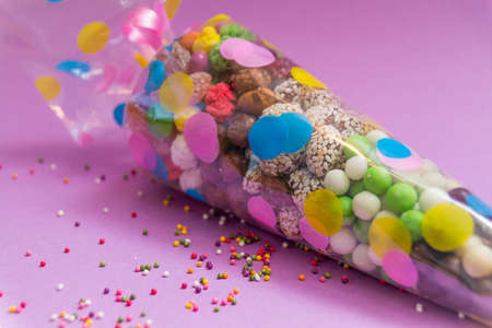 Nuts and sweets packed in a transparent plastic bag with a picture. A festive tuba.の写真素材