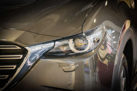 Car headlight with shallow depth of field. Car.の写真素材