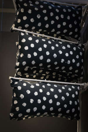 comfortable colorful fabric cushions on modern store shelves.Objects.の写真素材