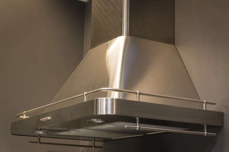 Elegant stainless steel kitchen cupboard, on a gray background. Objects.の写真素材