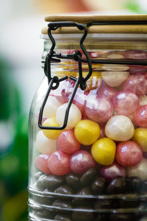 A large container with colorful candies with a tight-fitting lid. Sweets,の写真素材
