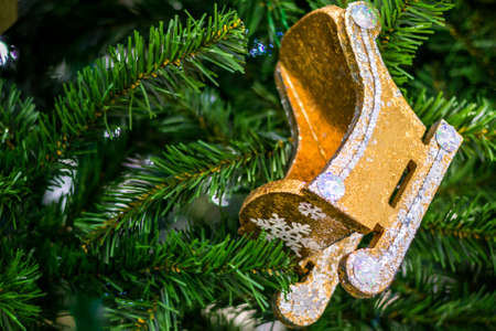 Wooden sleigh on a Christmas fir. Winter, Christmas, New Year. Foregroundの写真素材