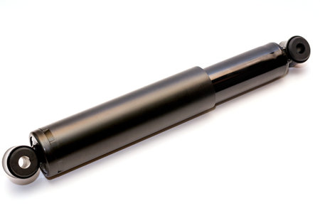 Black shock absorber for trucks on a white background withの写真素材