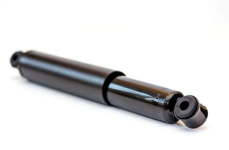 Black shock absorber for trucks on a white background withの写真素材