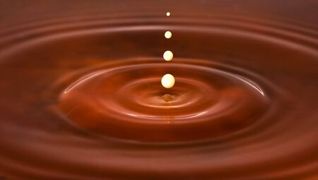 The milk drop in the coffeeの写真素材