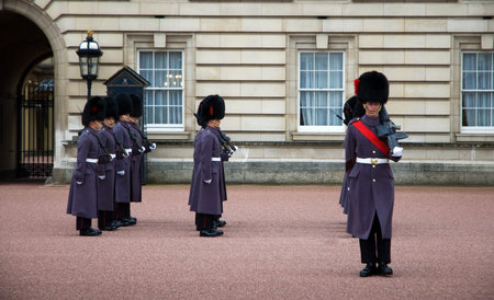 LONDON - NOV 17: Soldiers march as they participate in the Changing of the Guards at Buckingham...