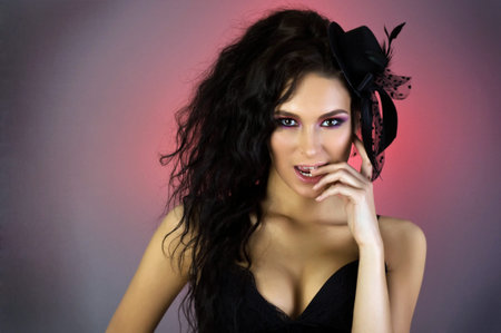 Portrait of young beautiful woman in little hat. の写真素材