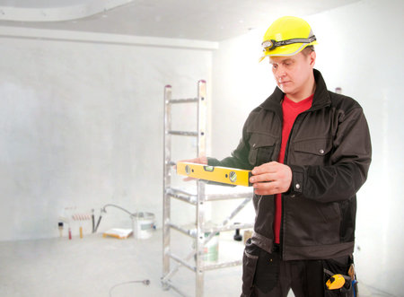Contractor worker with helmet planning building process