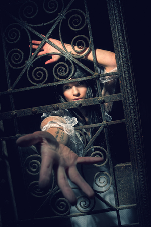 Witch from a crypt in the cemeteryの写真素材