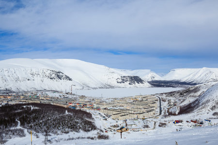 russian polar city covered with snow surrounded mountainsの写真素材